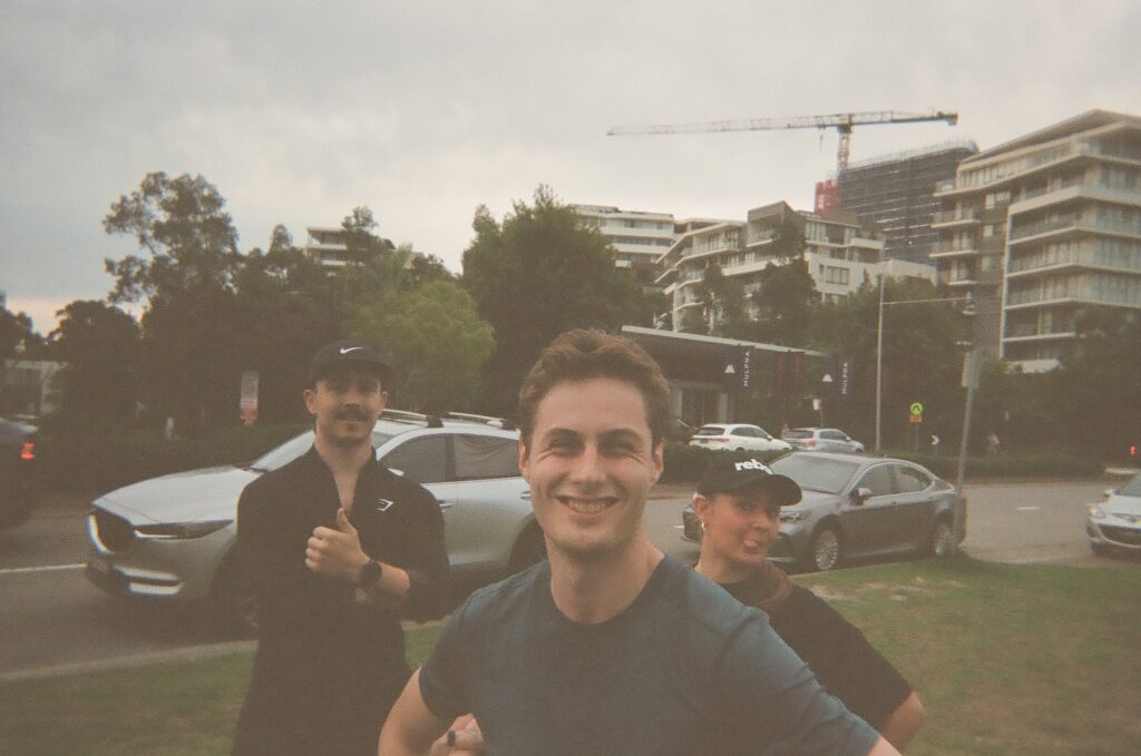 Three Hills Run Club runners smiling together after a run