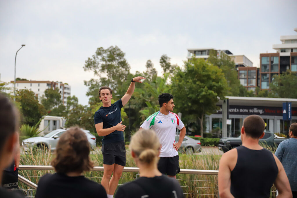 A group of Hills Run Club members gathered together at a night run