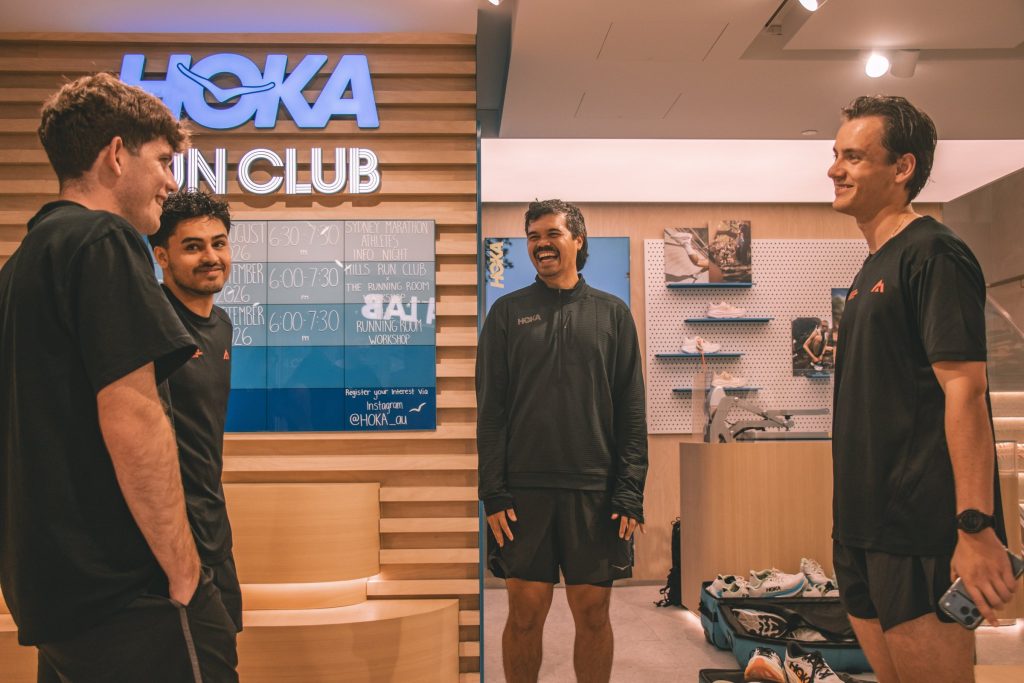 Hills Run Club members at the HOKA Run Club wall in HOKA Pitt Street