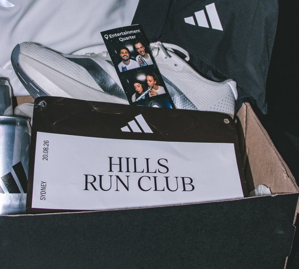Hills Run Club placard dated 20.08.26 in an adidas box with running shoes